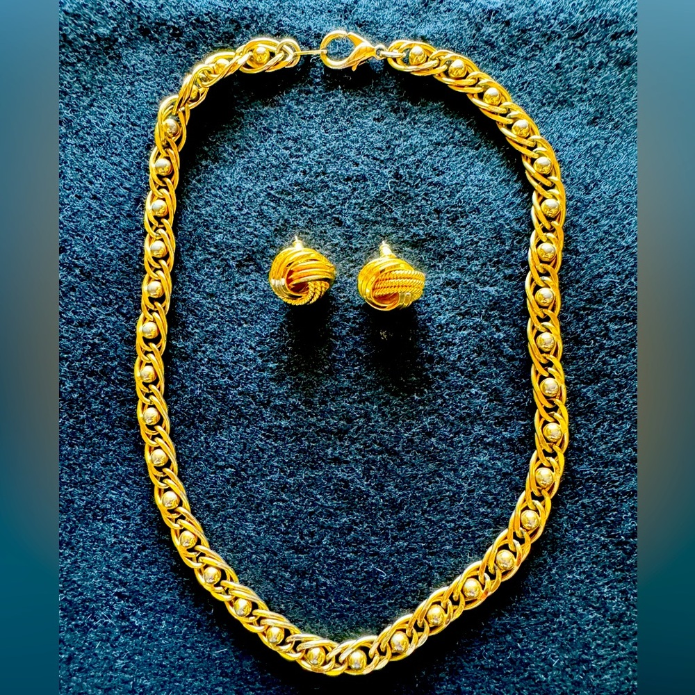 Gold tone chain necklace and matching post earrings.